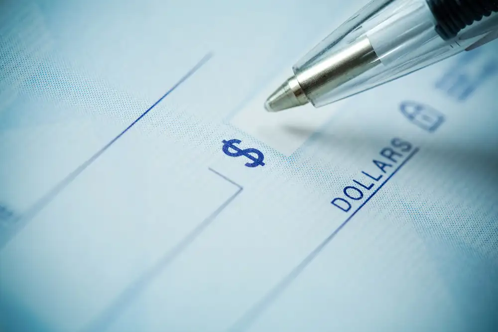 Pen writing a check.