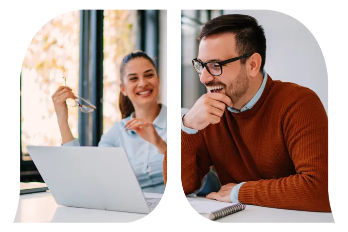 A man looking at his laptop while the woman is looking at him.