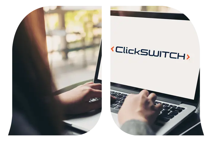 A woman's hand using a keyboard on a laptop that displays ClickSWITCH.