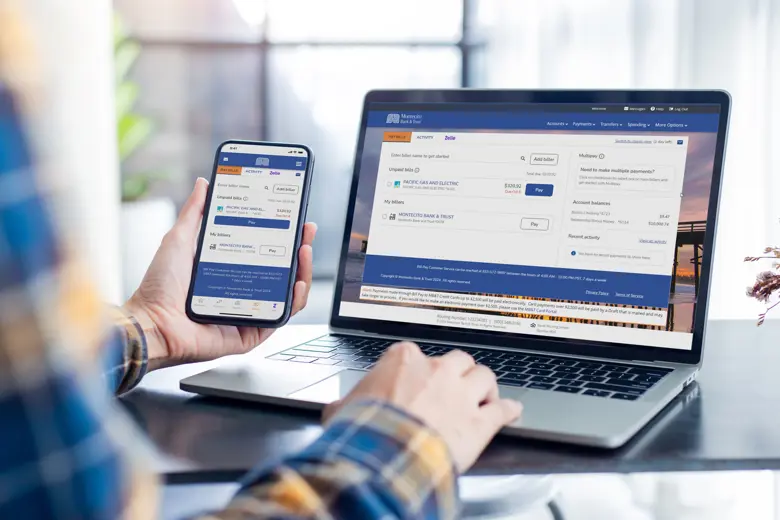 A laptop and phone displaying Bill Pay and eBills.