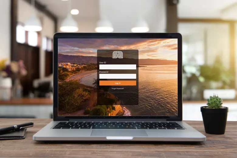 A laptop displaying Montecito Bank and Trust online portal.