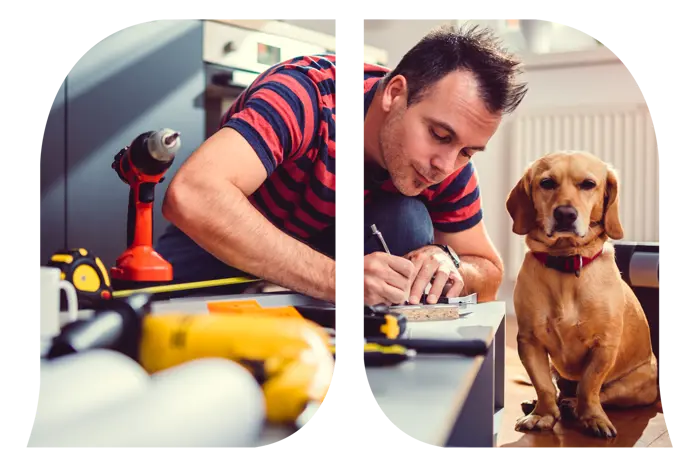 A man working on construction next to his dog.