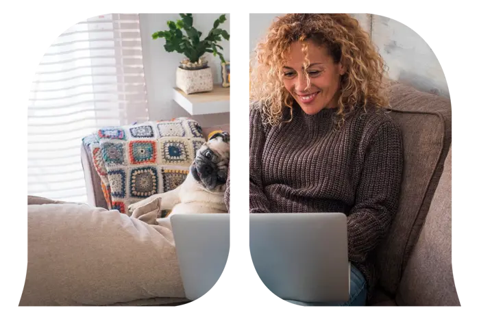 A woman and her pug looking at her laptop.