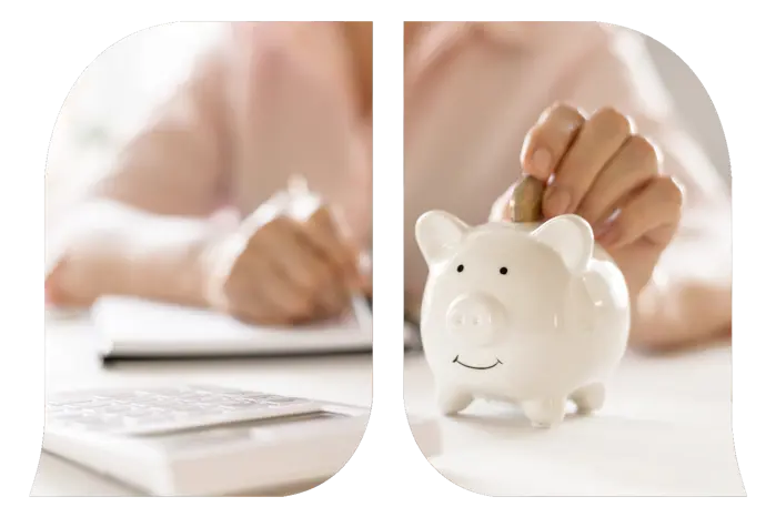 A woman's hand inserting a coin into a piggybank.
