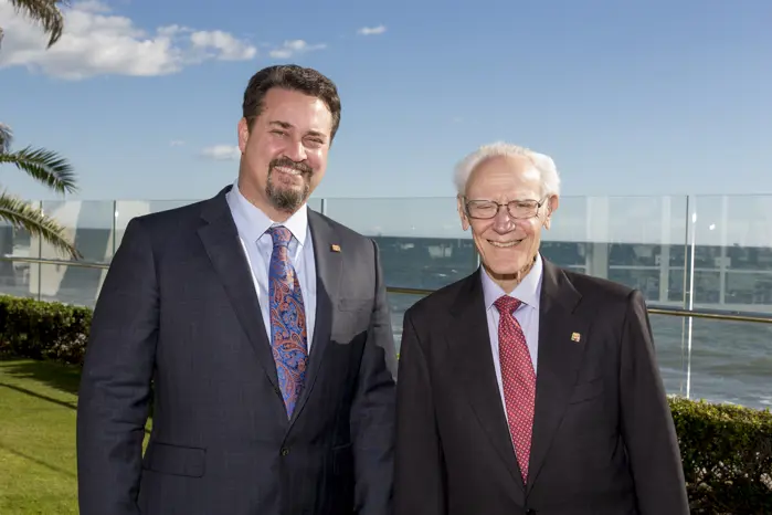 The Director of Wealth Management stands next to Montecito Bank & Trust's founder.